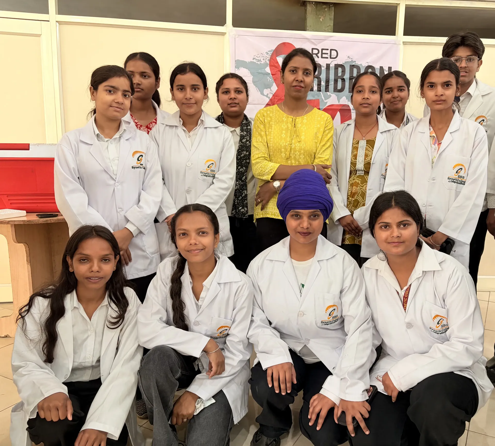 Blood donation camp — students donating, Red Ribbon Club banner