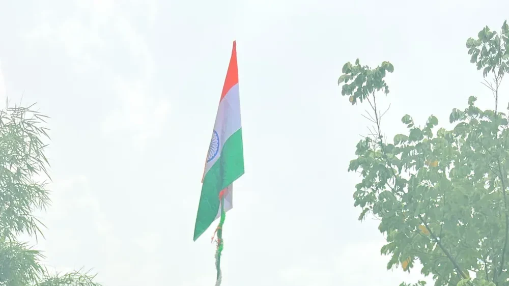 Flag hoisting ceremony at SBS — students and faculty gathered on Independence Day